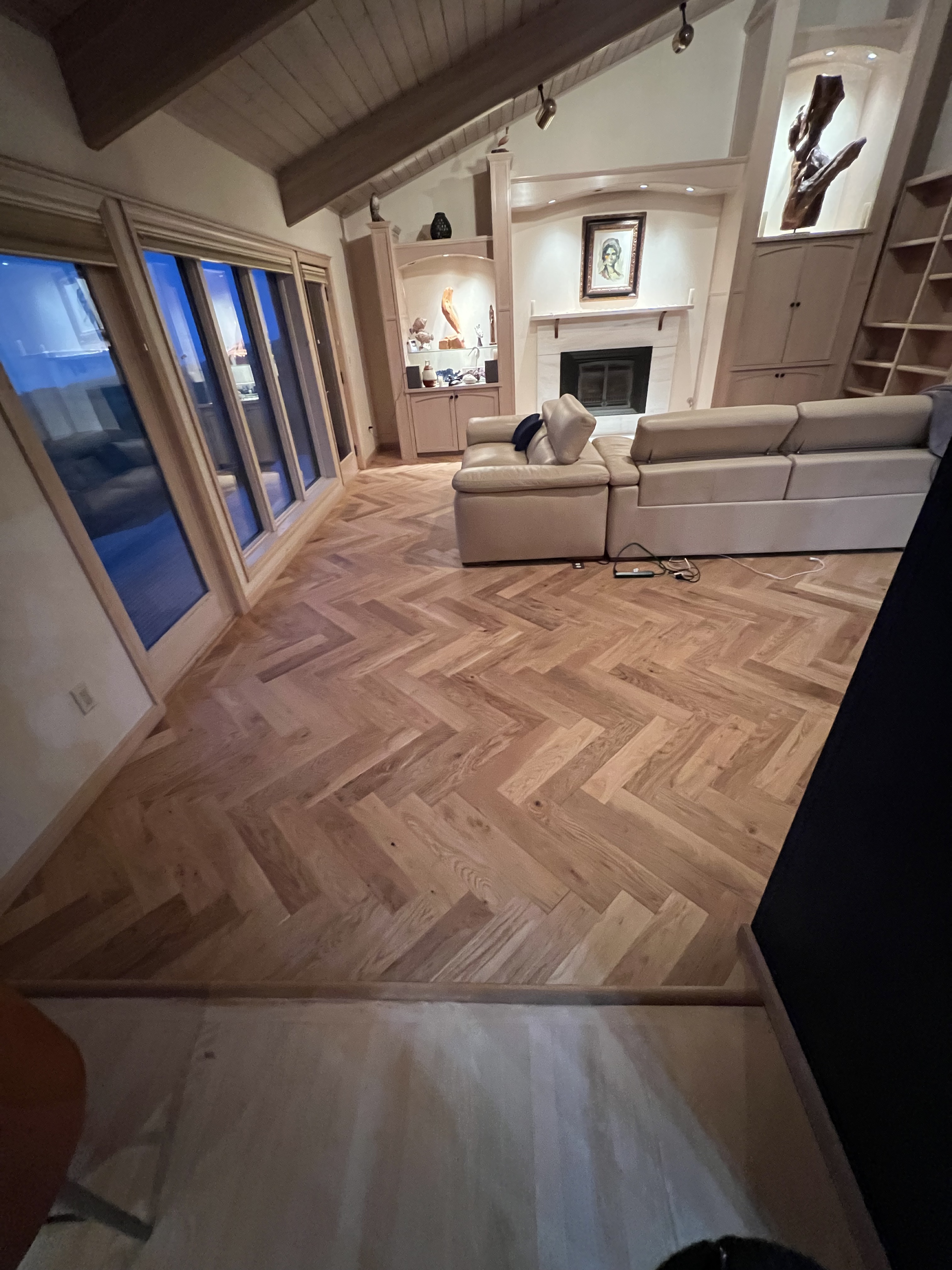 Herringbone floor near large windows