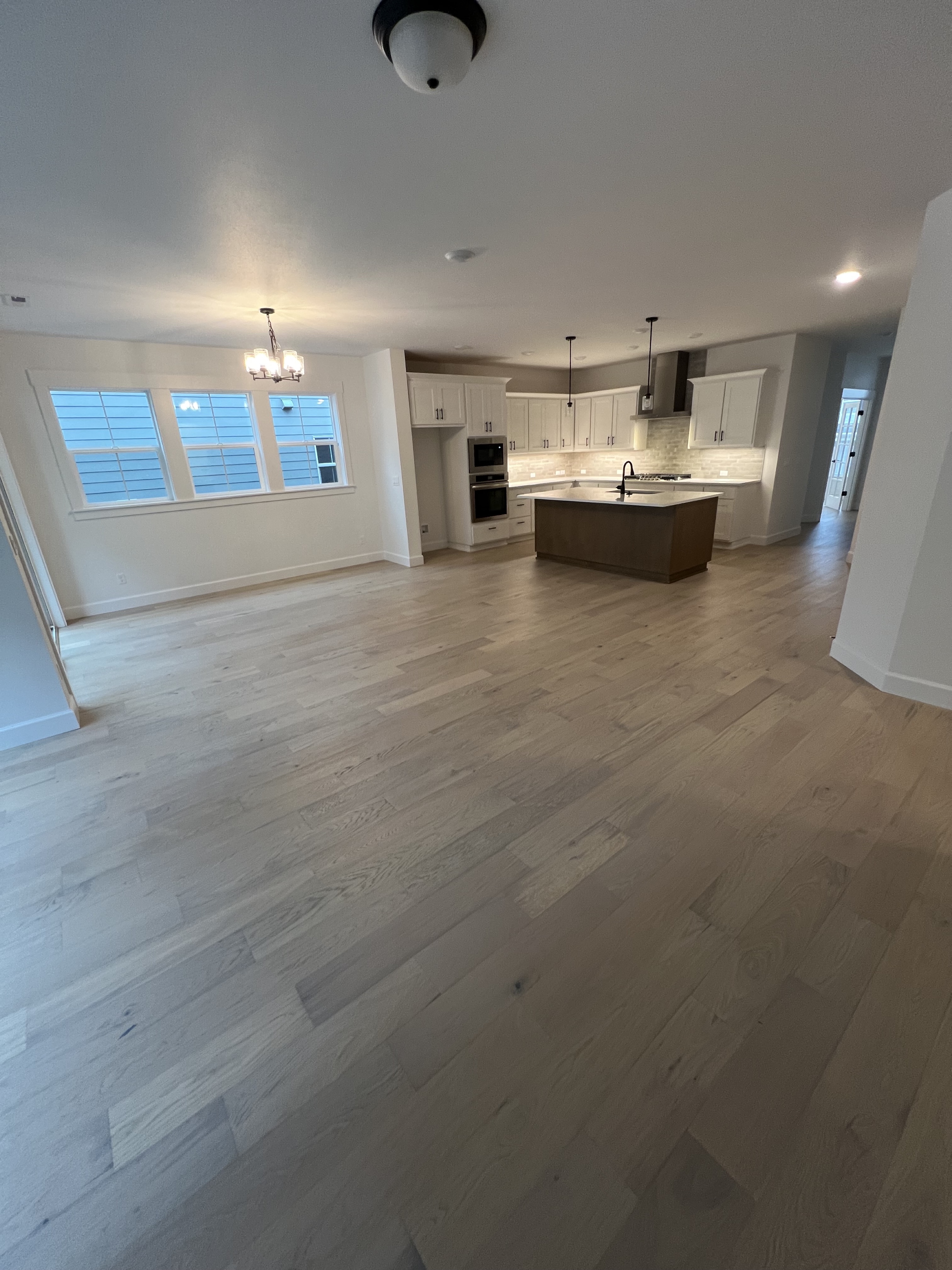 Large open space with the same light oak floor